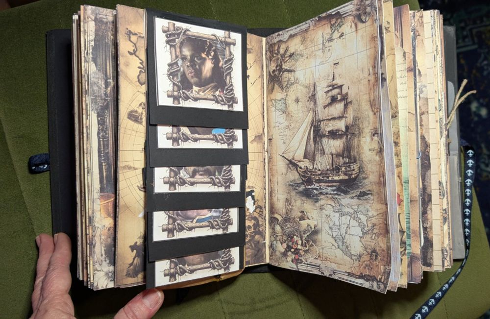 Another spread from the journal with a flip folio of photos on the left and another drawing of a ship on the right.