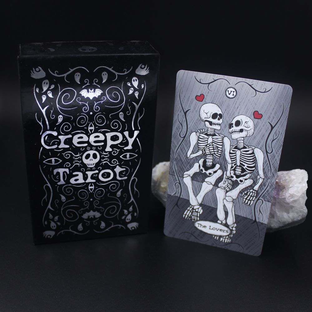 Creepy Tarot deck box and The Lovers card with two skeletons