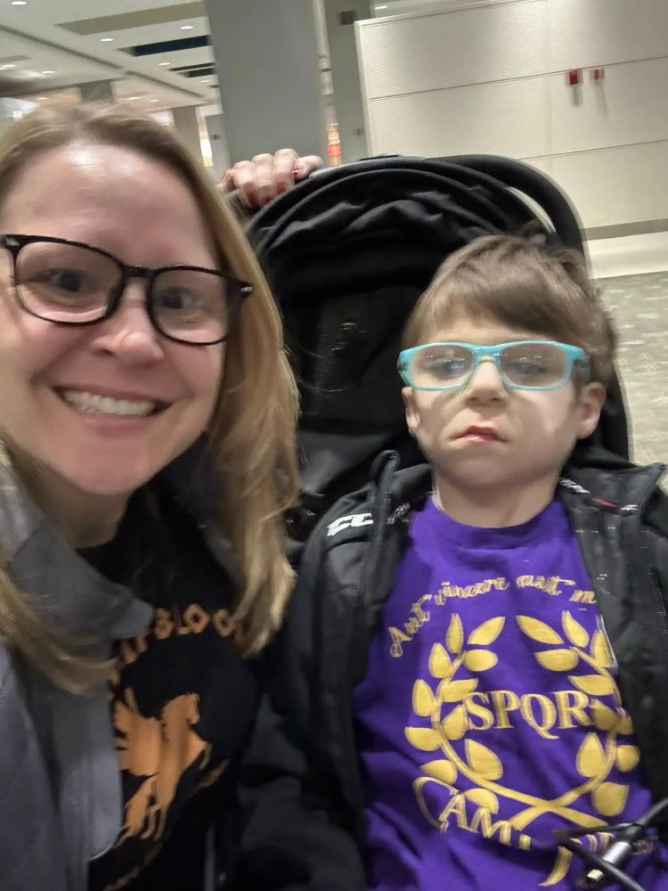OP and son wearing Camp Halfblood and Camp Jupiter t-shirts from the Percy Jackson and Heroes of Olympus books by Rick Riordan. 