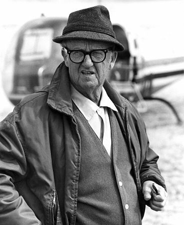 Cinematographer Robert Surtees, wearing a hat and glasses