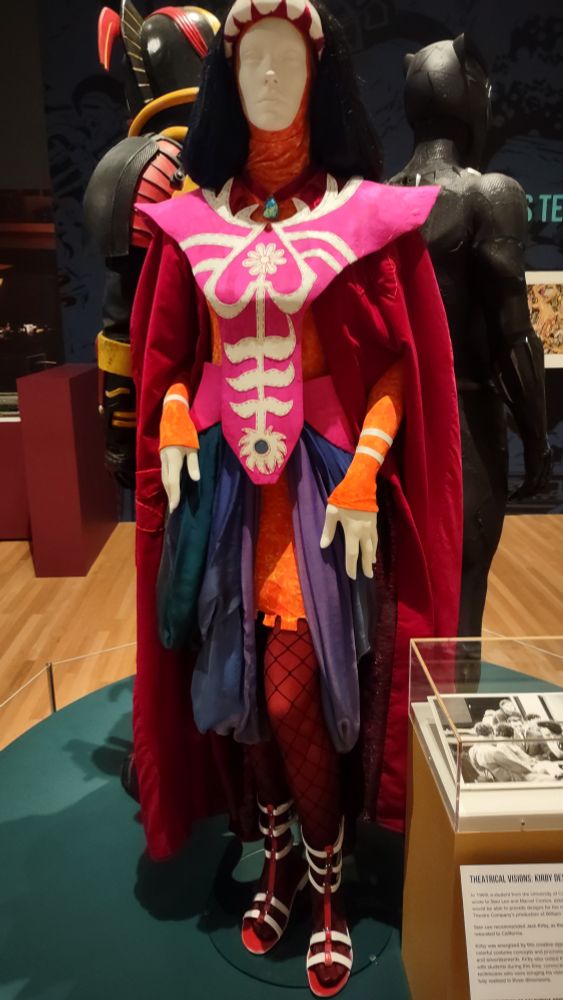 Loose layers of bright colors with a cool pink and white embroidered cassock. Like a high contrast painting stepped off the page and into real life!
