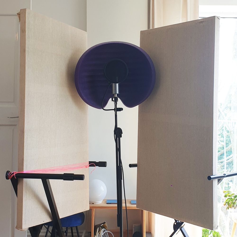 Acoustic panels mounted on keyboard stands, an ad hoc vocal booth.