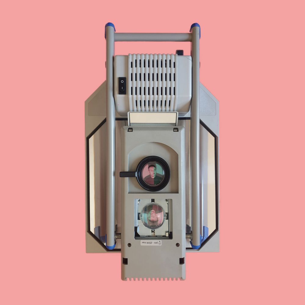 Album artwork for Leo Chadburn's "The Subject / The Object": a square piece of machinery, made of grey metal and mirrors, with a single on/off switch (actually a folded overhead projector) against a pink background.
