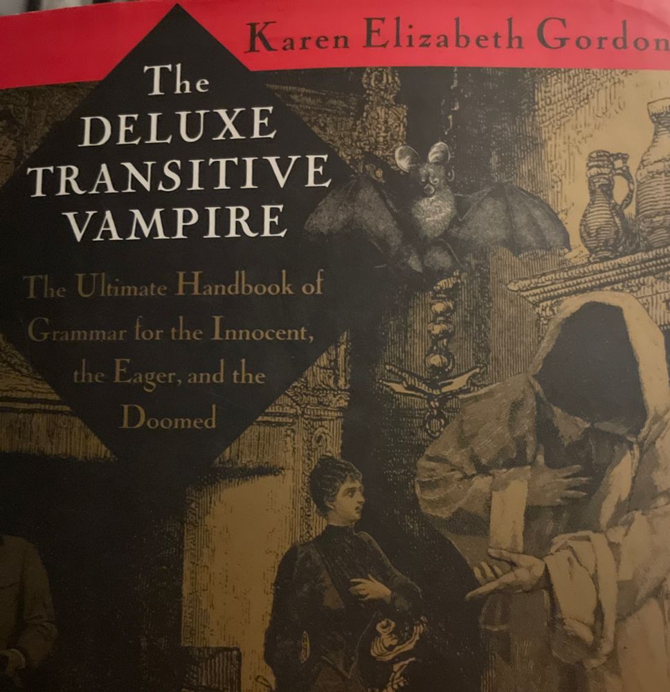The DELUXE TRANSITIVE VAMPIRE: The Ultimate Handbook of Grammar for the Innocent, the Eager, and the Doomed. By Karen Elizabeth Gordon. Spooky dark cover with engravings of people and bats and stuff. Red stripe where the authors name is. 