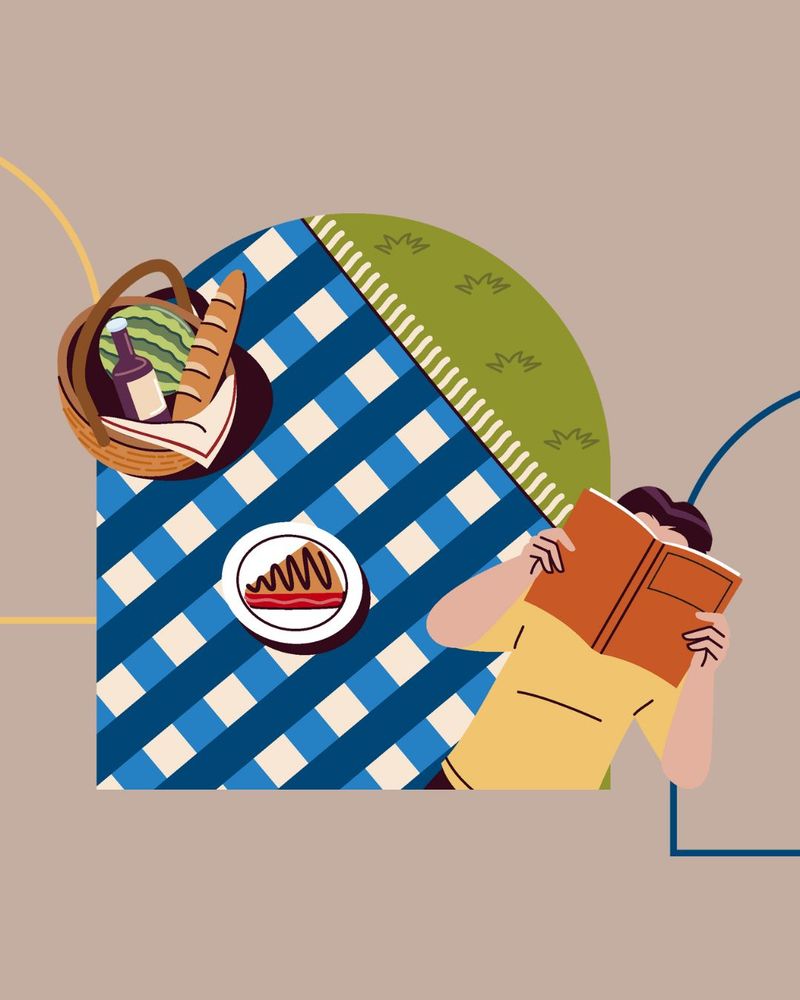 Graphic of a picnic blanket, a picnic basket, and a person reading a book. 