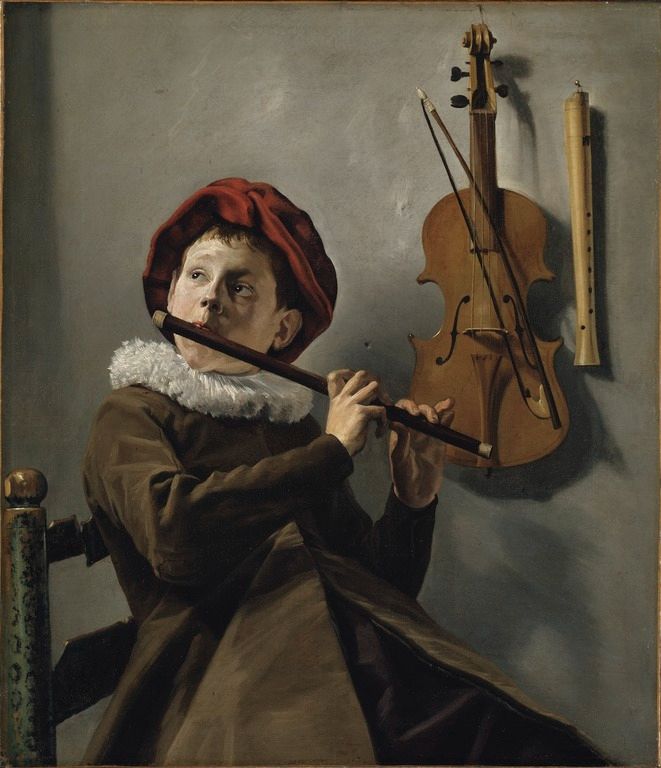 A boy wearing a brown coat, a red cap, and a white ruff collar sits on a ladder-back chair, playing a flute. He gazes up toward the top left corner (as the viewer sees it) of the painting. To his left, the viewer's right, a violin with a bow and some kind of recorder hang on the wall.