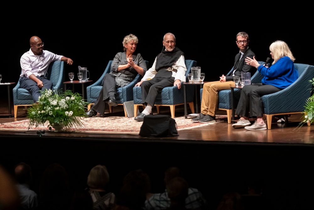 Brother David Steindl-Rast in a panel onstage during the symposium.