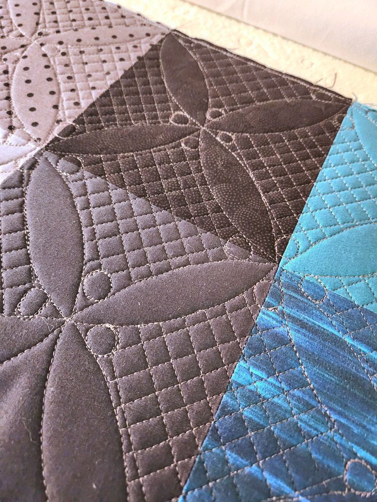 Quilt squares up close to show the quilting,  or stitching, that I've been practicing.  