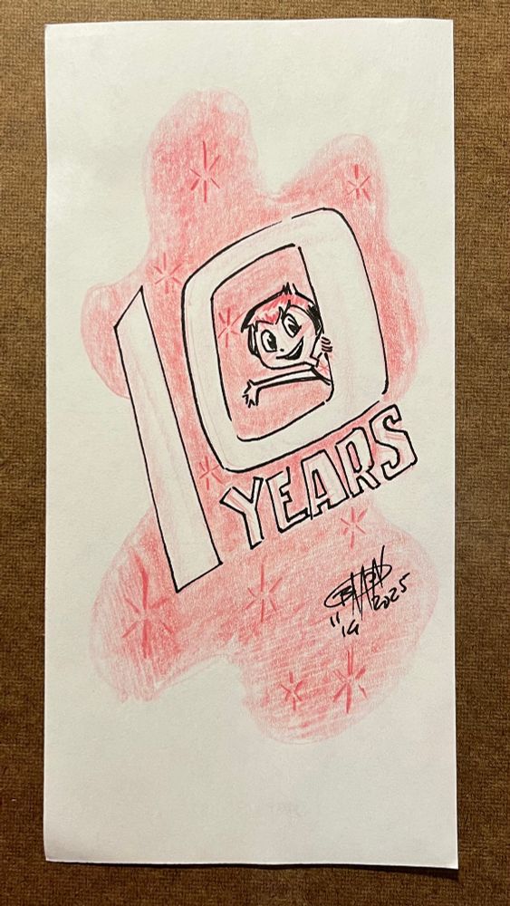 Joy peers out of the zero in the numeral “10”. 10 years. 