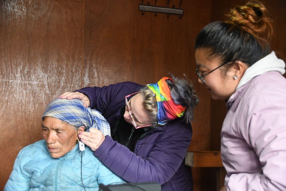 Dr Huch is showing a Nepalese nurse how to use real ear measurements