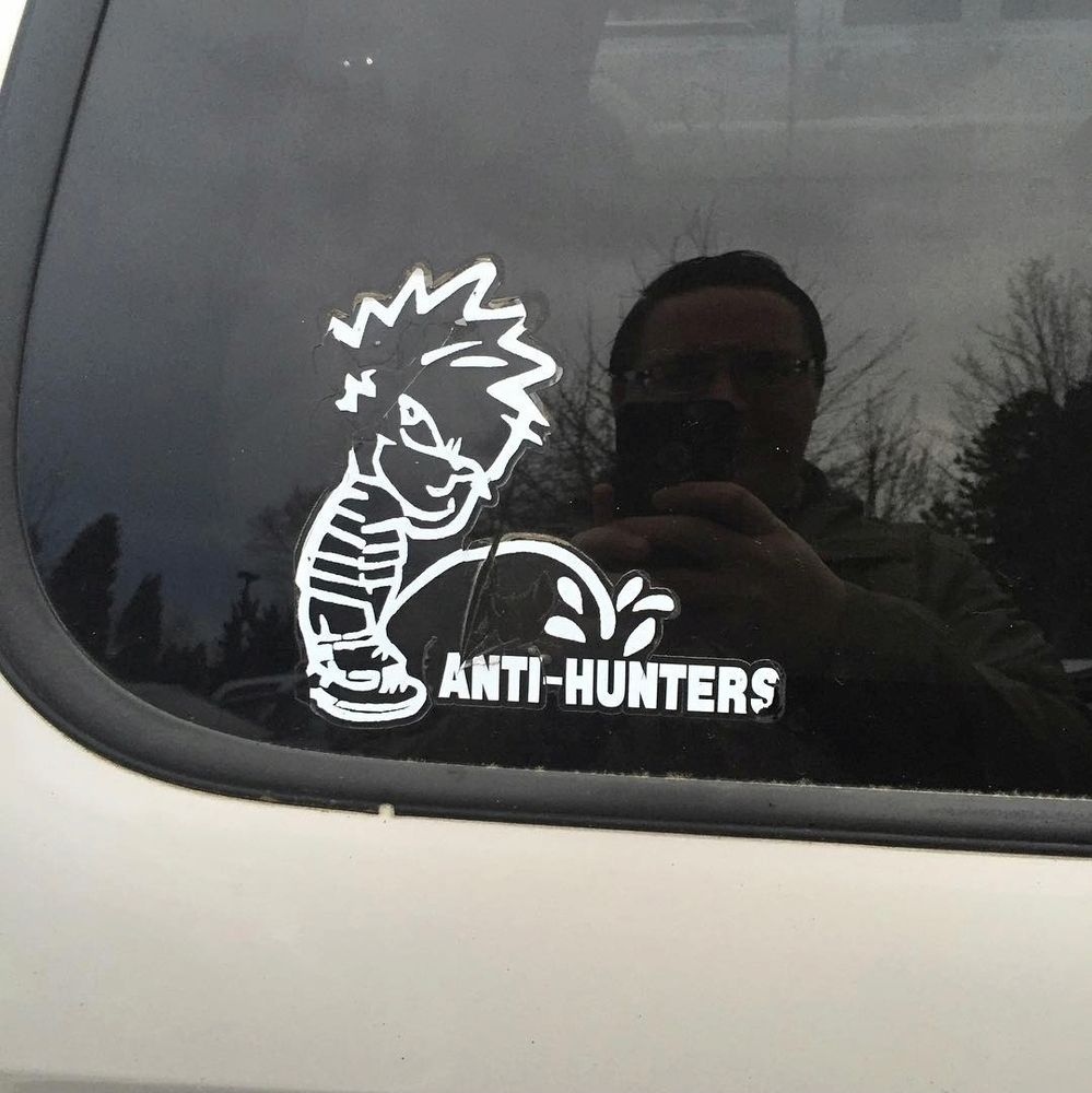 Car decal of Calvin pissing on the word "Anti-Hunters"