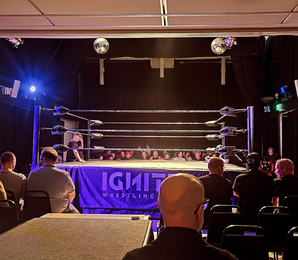 A shot of the ring at 96 Shenley Road moments before Ignite Wrestling Pro's "Last Stand" event. The photographer is in the back row of the section, behind and next to the wrestlers' entrance. 