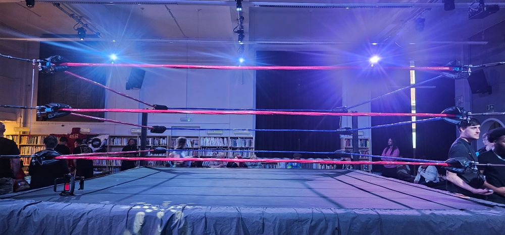 A view of the ring prior to Purpose Wrestling's "Mutiny!" show.
The entrance is to the right of the picture, with the shelves of the venue's library prominent in the background. 