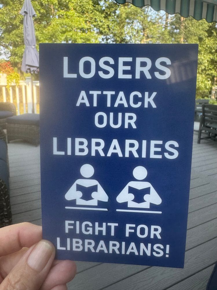 Blue postcard. Text: Losers attack our libraries. Fight for librarians!