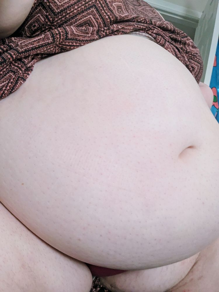 A non-binary fat cat's belly. It's full of four burger and fries and booze :)