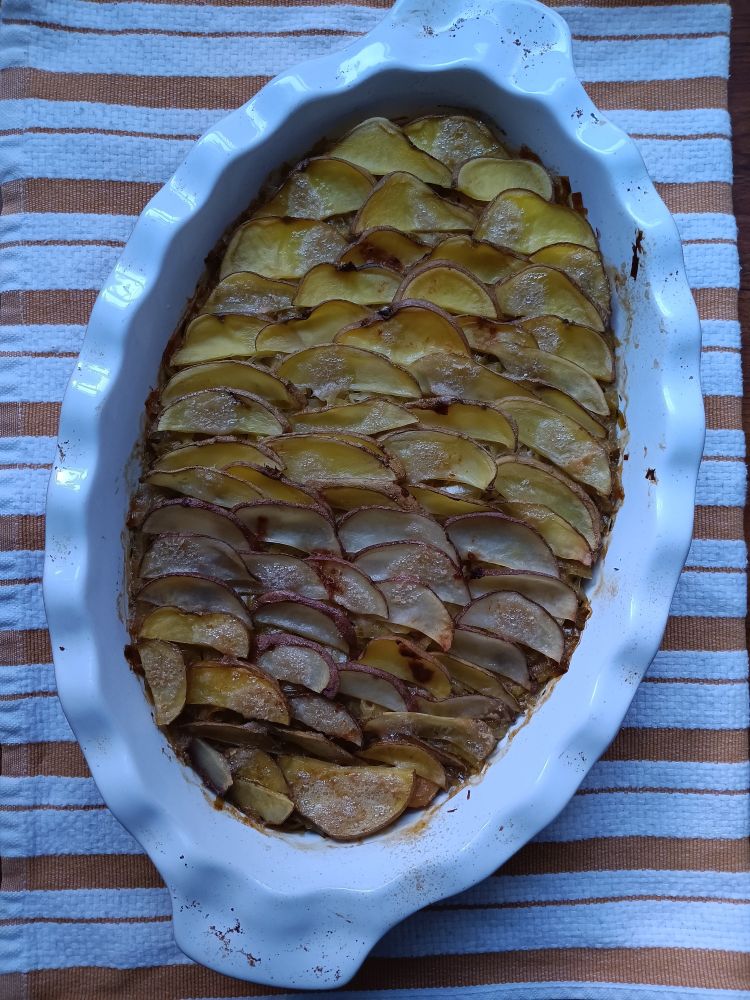 the baked dish, with the potatoes all crispy