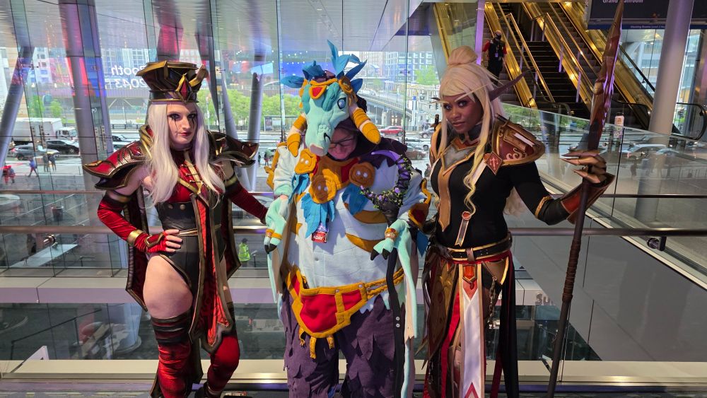Cosplayers at PAX East 2025 dressed up in World of Warcraft costumes. Left to right: Lady Whitemane, Zandalari Moonkin, and Paladin T2 set.