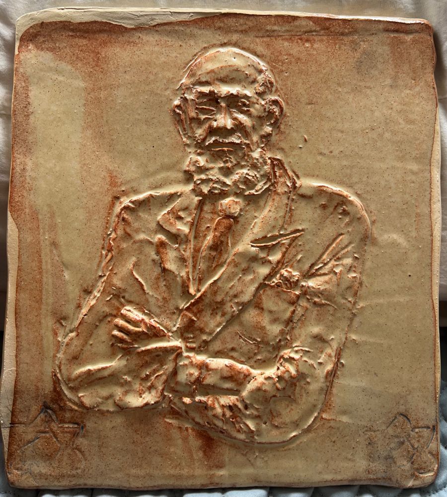 Same relief tile after firing, then glazing with a sort of sepia color, and refiring…