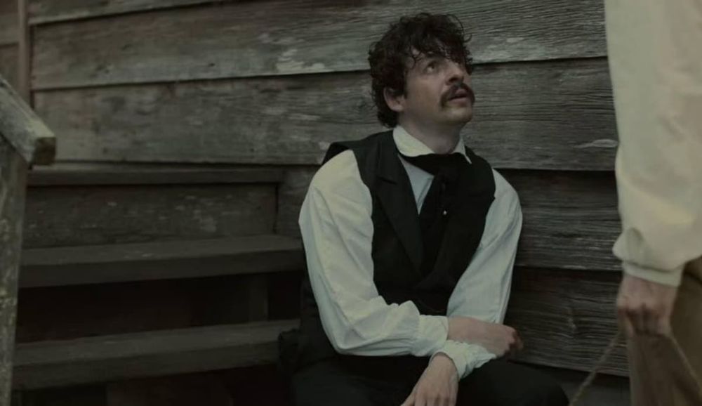 Anthony Boyle with a John Wilkes Booth mustache in MANHUNT.