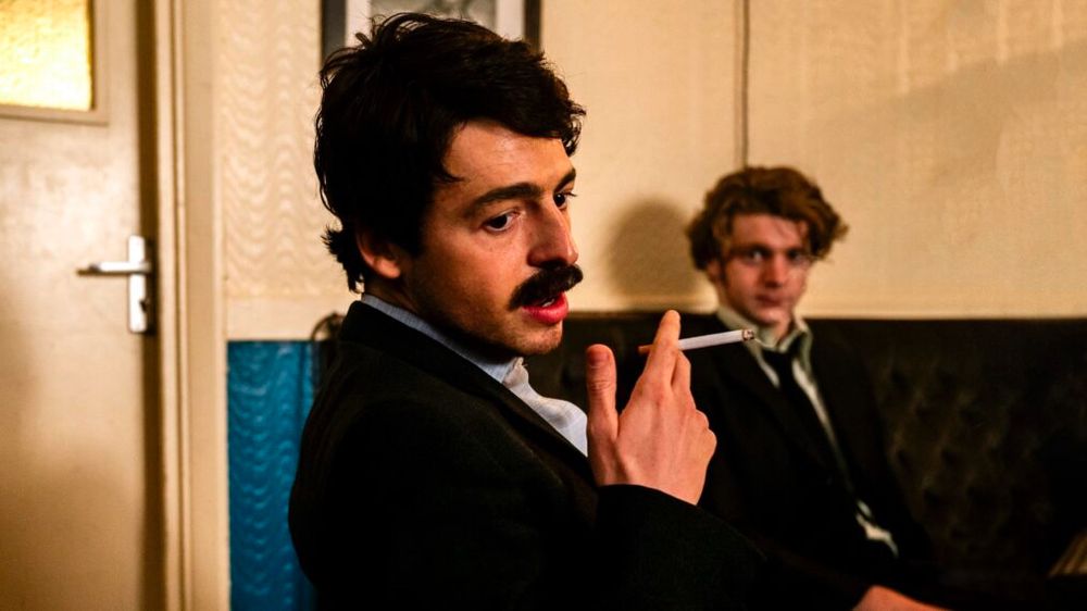 Anthony Boyle with the mustache of Brendan Hughes in SAY NOTHING.