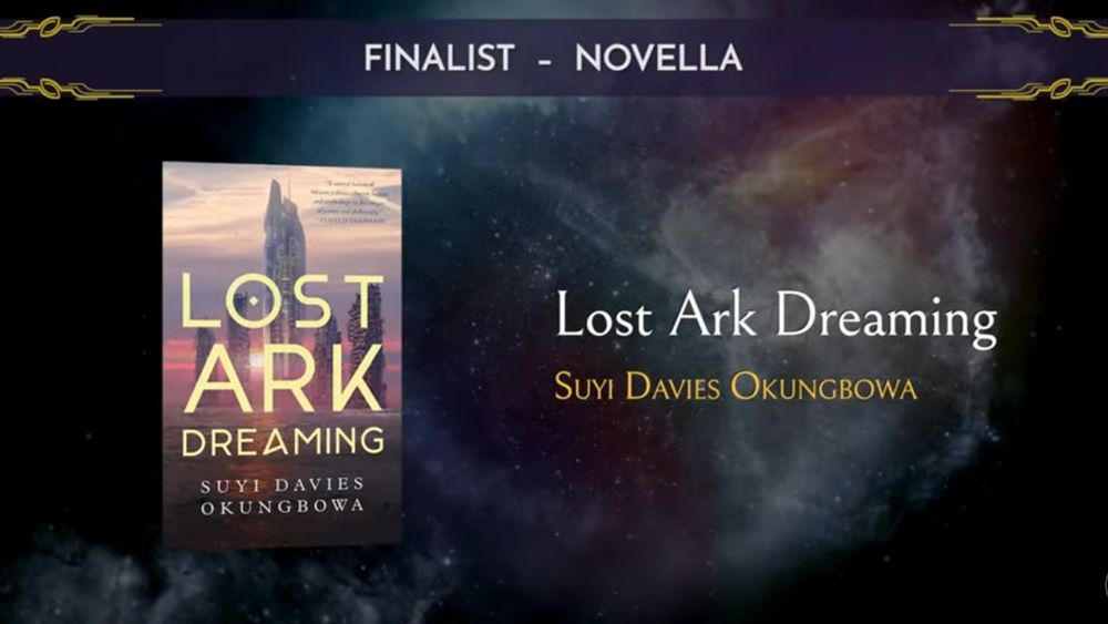 The cover of Lost Ark Dreaming by Suyi Davies Okungbowa, over a background of a star nebula, announced as a finalist for the Best Novella Award in the 2024 Nebula Awards.