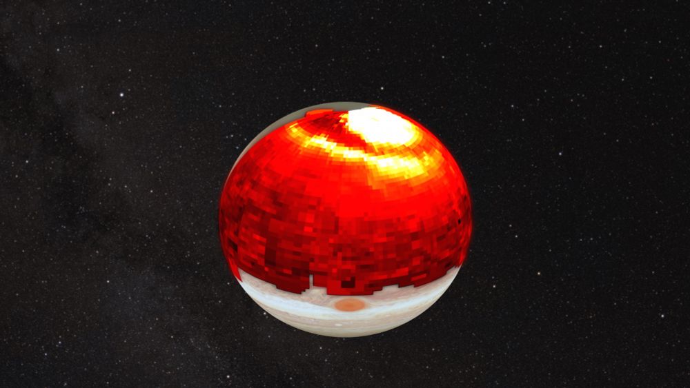 Visible-light image of Jupiter overlaid with infrared data, showing the planet’s bright auroral regions at the poles and a large, arc-shaped heat wave extending toward the equator.