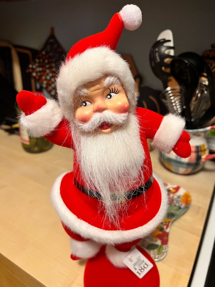 Vintage 1950’s or 60’s Santa doll in a red and white suit. He has a creepy vibe.