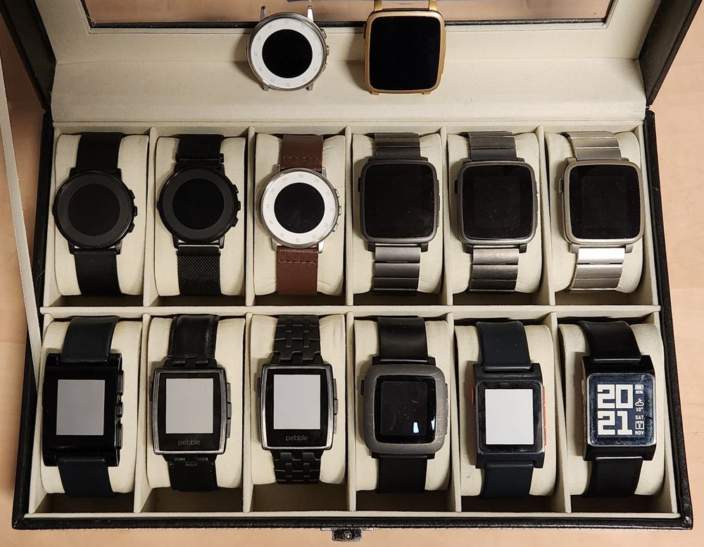 14 Pebble watches form earlier generations in a watch collector's case