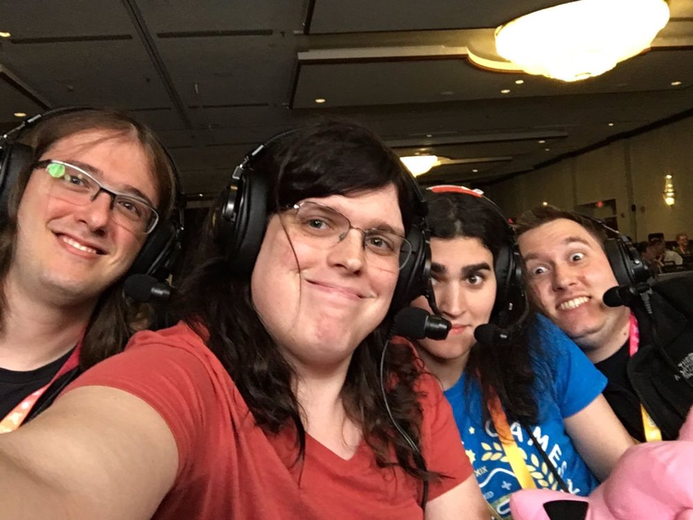 Four people in a selfie right before the start of a speedrun at an event. 