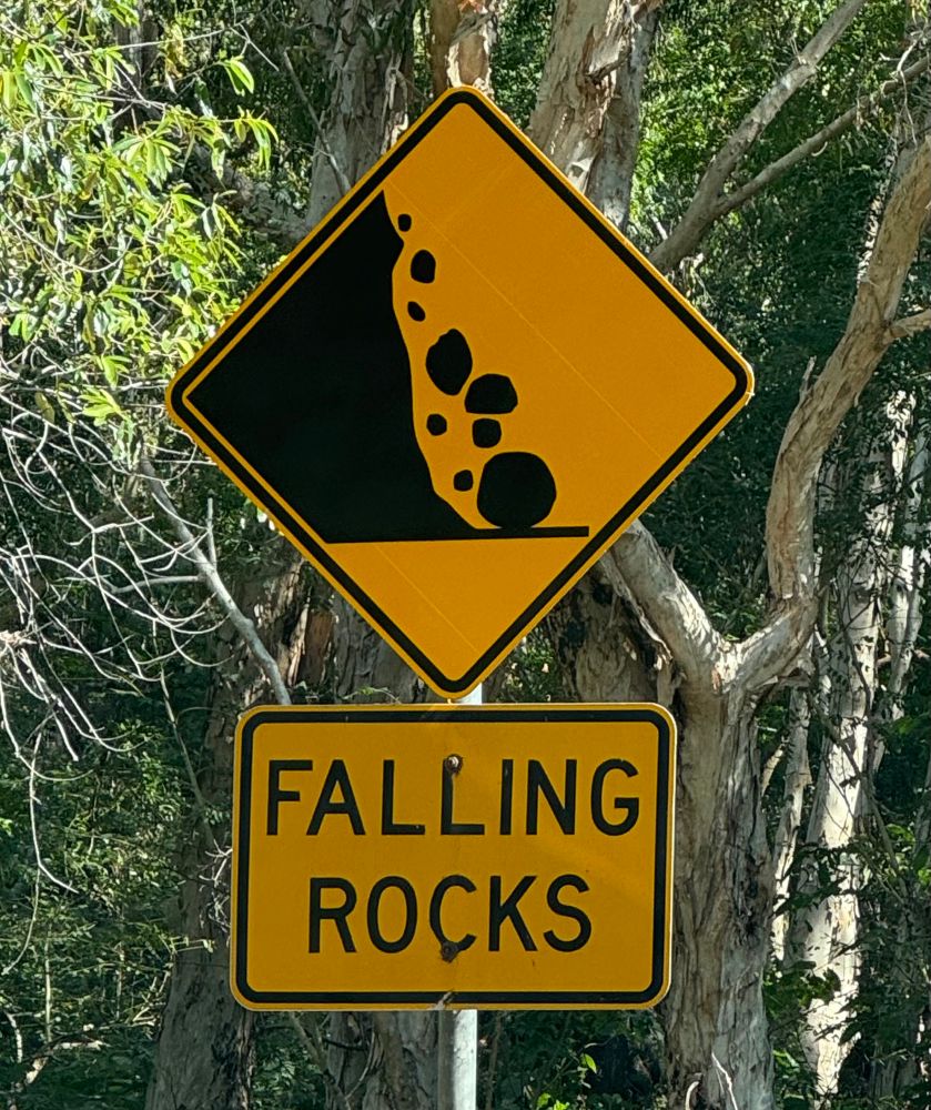 Sign reads: Falling rocks 