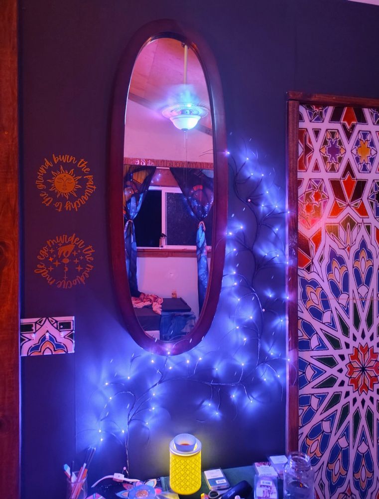 Green wall background, mirror, lights and the aforementioned vinyl stickers
