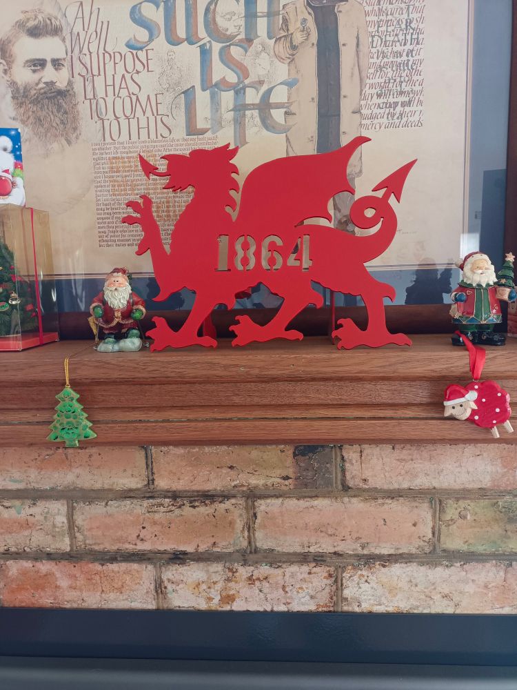 The sweet as Dragon against the Aussie as Ned Kelly such is life poster. 