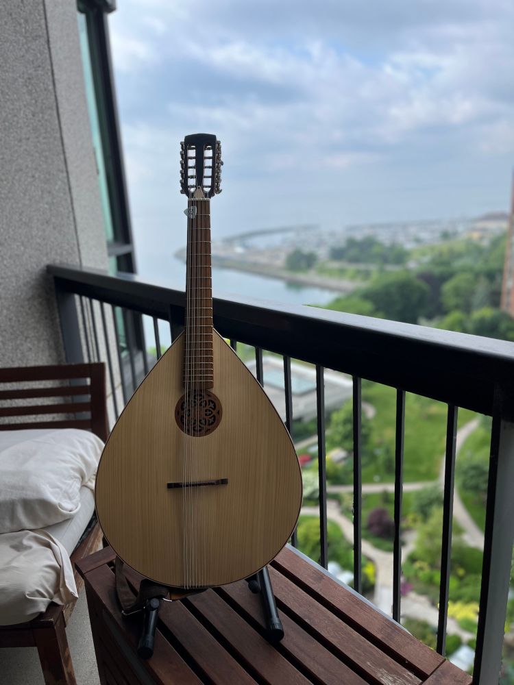 Mandocello on balcony overlooking Lake Ontario.