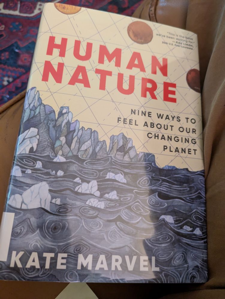 A copy of Human Nature: Nine Ways to Feel About Our Changing Planet by Kate Marvel. 