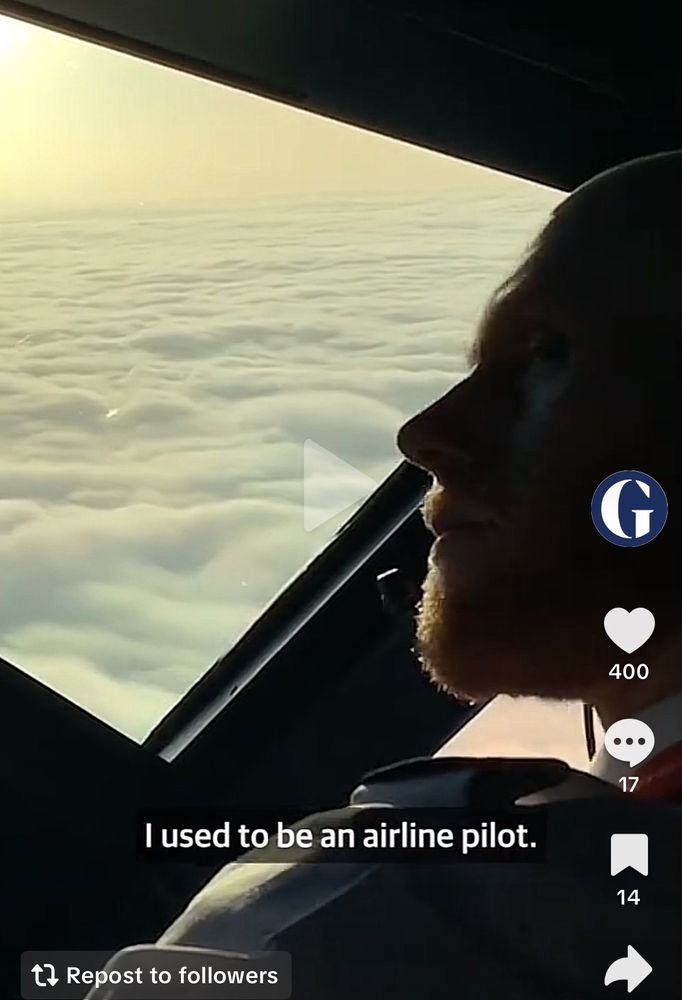 Image of former pilot George Hibberd with the cockpit window showing him flying over clouds.