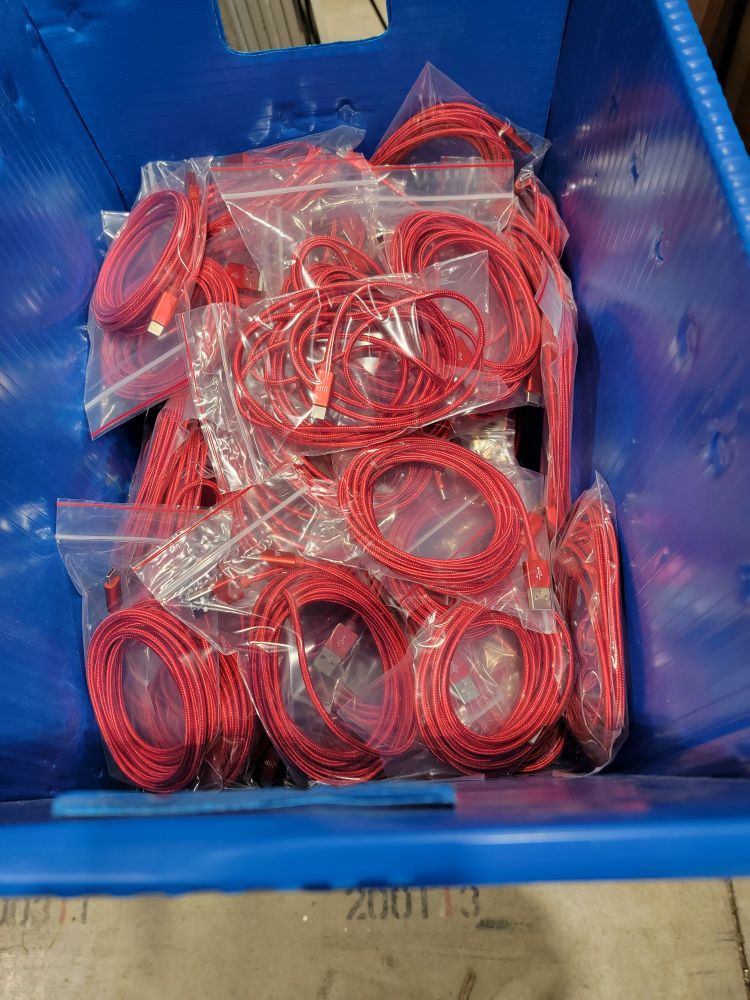 many red usb-c cables in a box