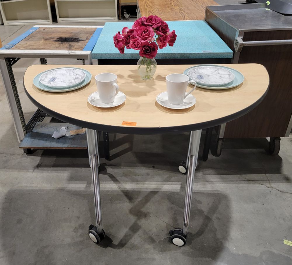 Half-moon table set for a romantic dinner for two
