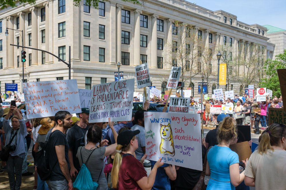 Hands off protest. 

Signs:
PREVENTABLE DEATHS: TRUMP MUSK REVERSE PUBLIC HERITH CUTS

Doge Dog:
wow scary very digarchy