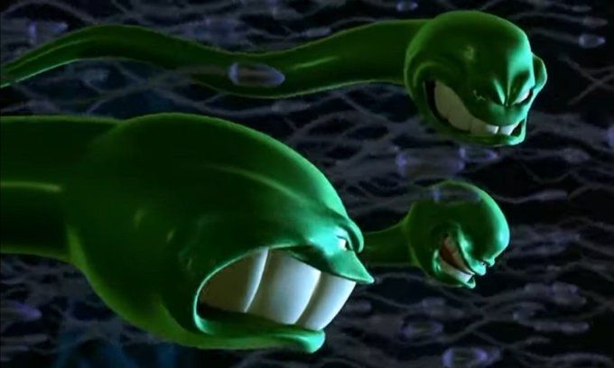 Three green CGI generated green sperm cells with angry faces.