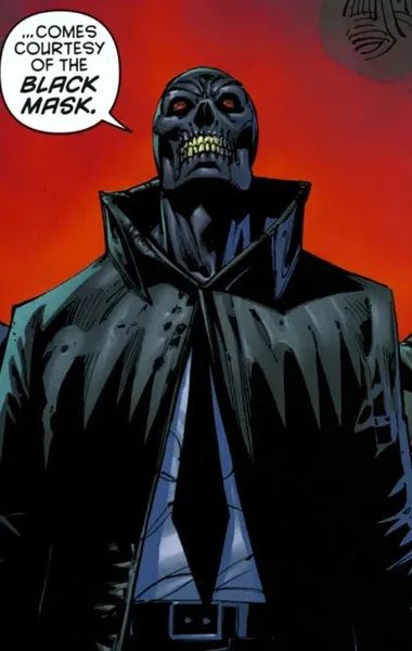 Black Mask (obsidian, skull-like features, white teeth and red eyes, wearing a black coat over a white shirt and black tie. He is saying "...comes courtesy of the Black Mask."

Art by Tony S. Daniel.