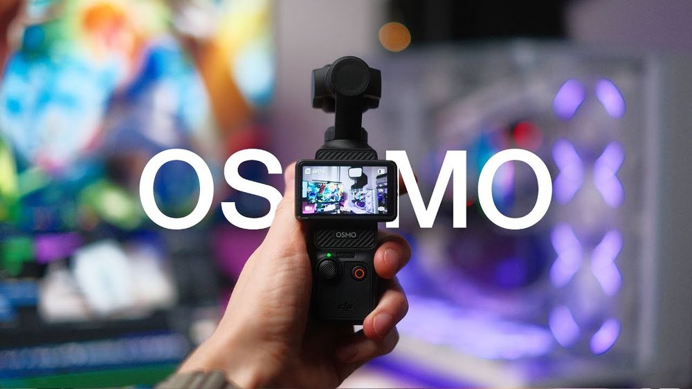 DJI Osmo Pocket 3 Camera held in hand with the text "OSMO" written behind it