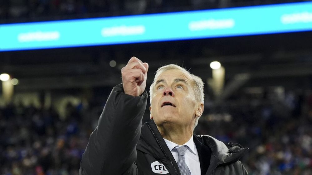 Mark Carney coin toss photo. 