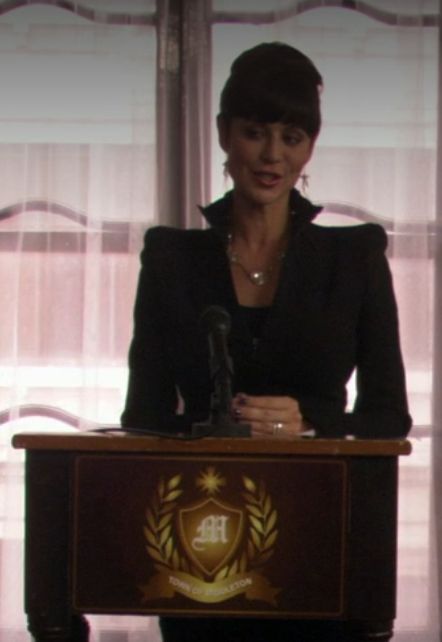 Cassie in The Good With's Family - note the shoulder pads and collar