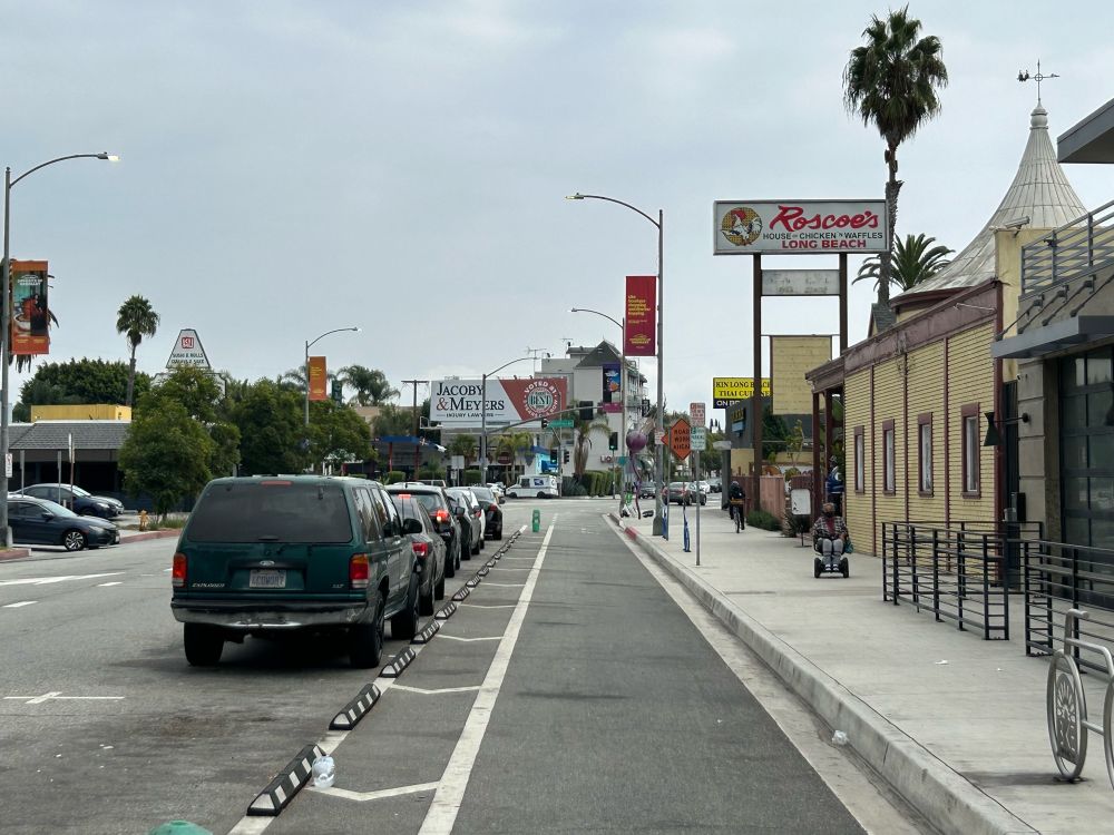 the protected bike lane runs for half a block and then disappears at the approach to a large intersection 