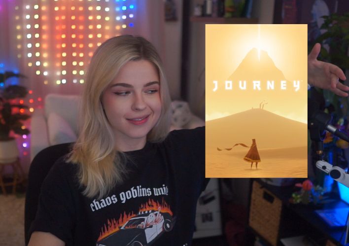Darian in her stream room with her arm around critically acclaimed game "Journey"
