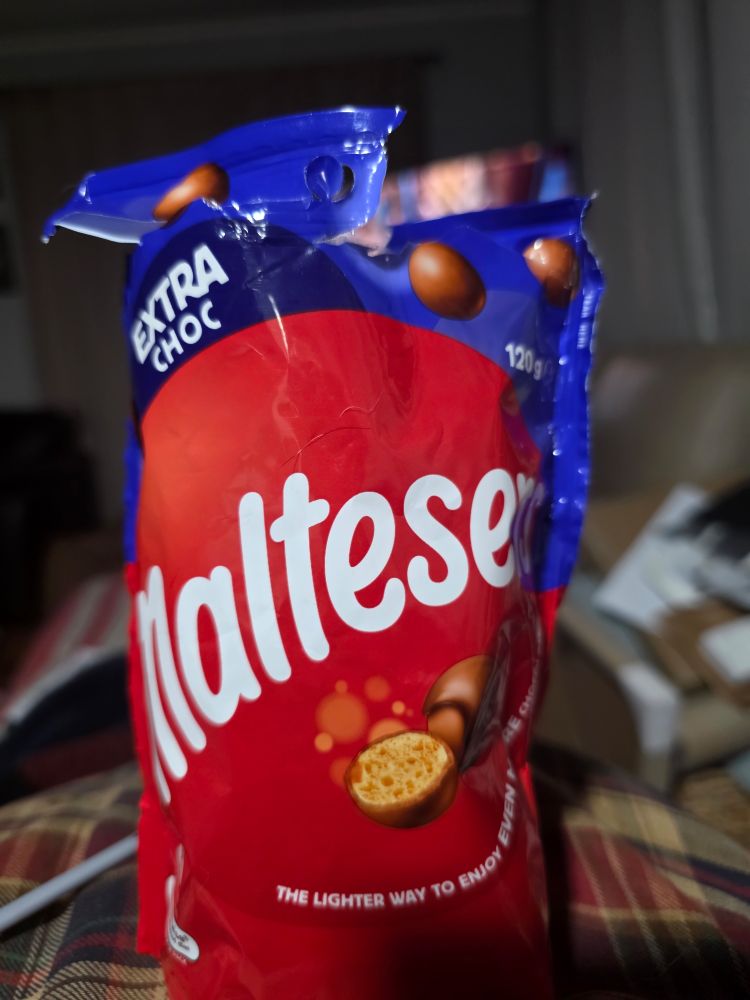A packet of maltesers chocolates with extra chocolate 