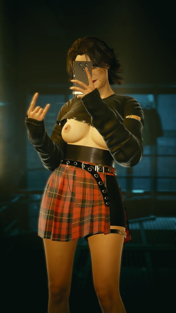 V (sometimes Valerie) from Cyberpunk 2077 taking a selfie with her face partially obscured. She wears a red plaid skirt that cuts off over her left thigh, exposing her tight shorts and a strap beneath them. Her bare breasts are exposed beneath a black long-sleeved crop top dotted with holes and tears. The side of her face that is exposed is smiling at the camera.
