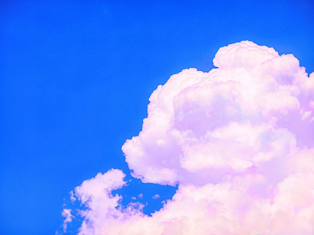 a cloud with a pinkish color