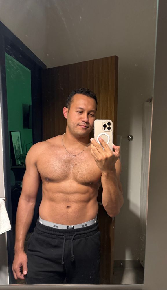 Shirtless mirror selfie