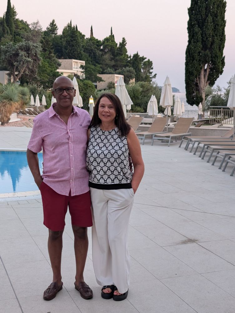A photo of a man and a woman in a hotel complex.